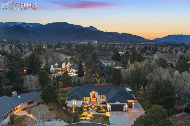 an aerial view of a house and outdoor space