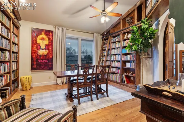 a dining room with furniture and wooden floor