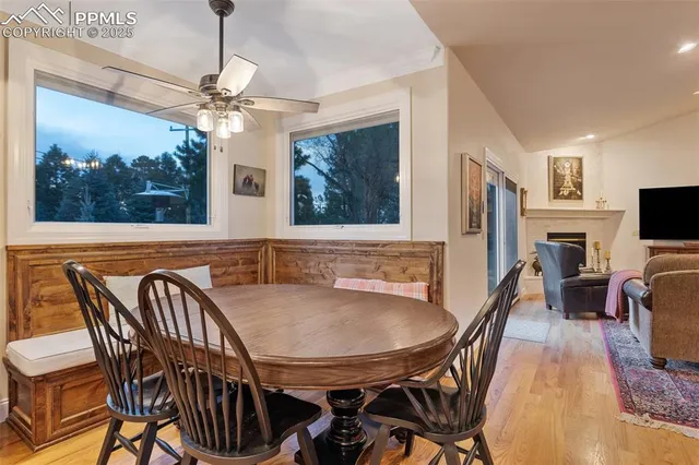 a view of a dining room with furniture window and wooden floor