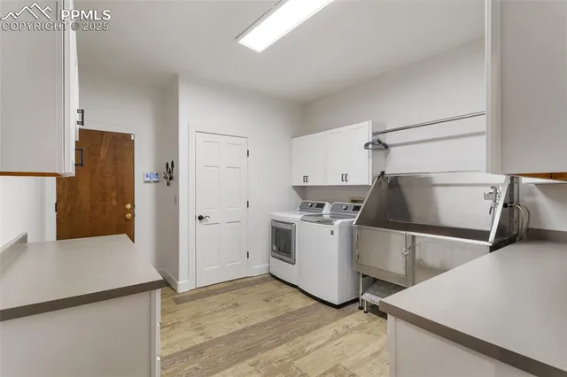 a kitchen with a refrigerator and a stove top oven