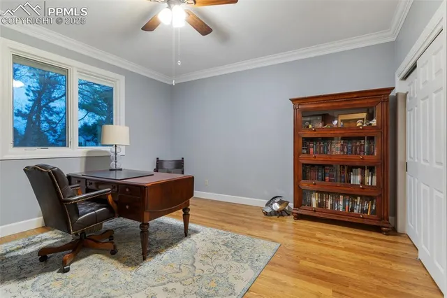 a workspace with furniture window and wooden floor