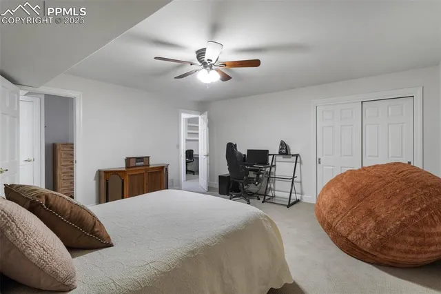 a bed room with a bed and a chair