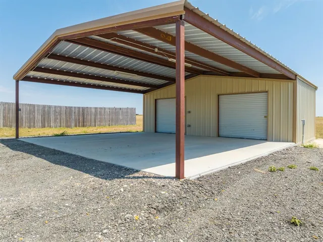 a view of an empty room with a ocean view and a window