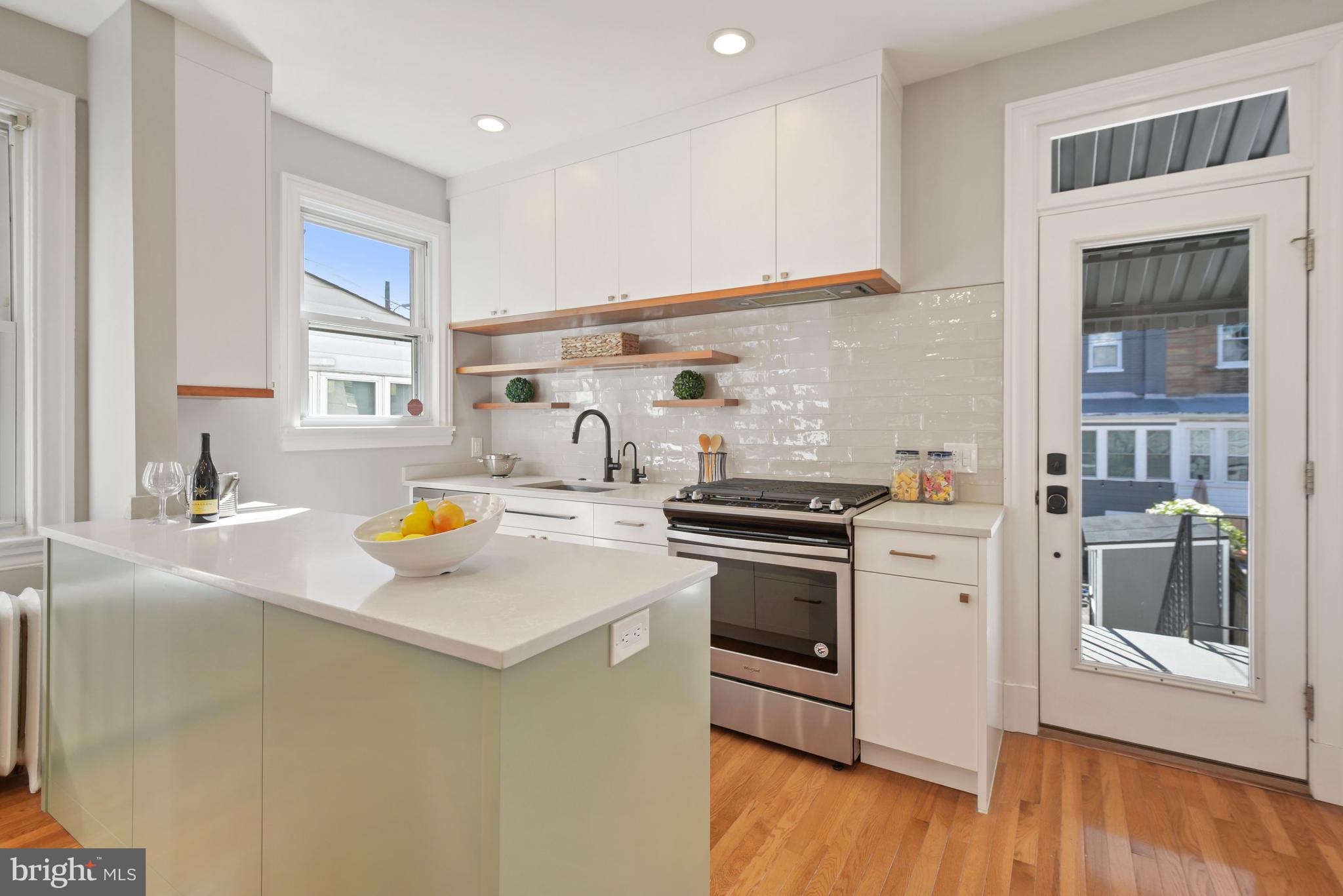 514 Tuckerman Street Northwest Washington, DC 20011 - Photo 11 of 30 Custom kitchen with access to paver driveway/patio