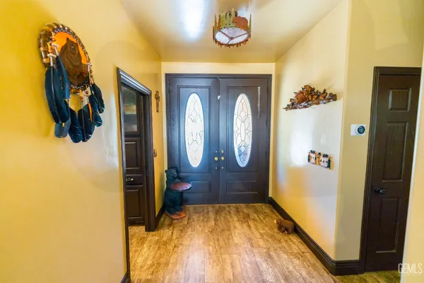 a view of walk in closet with rug and wooden floor