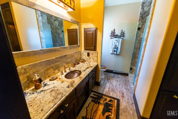 a view of a room with wooden floor and staircase