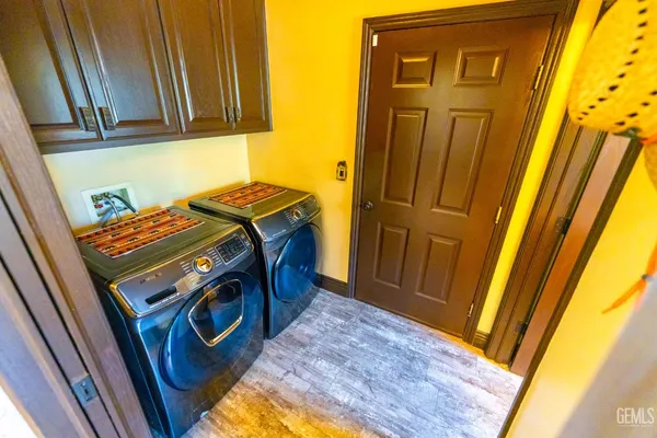 a outdoor living space with furniture and a flat screen tv