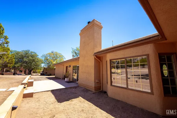 a view of a house with outdoor space and sitting area