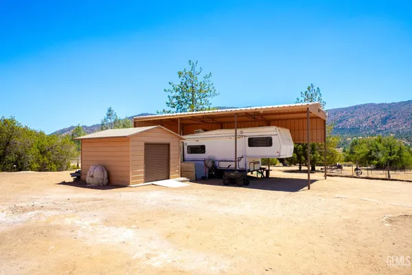 a view of lake with a tree in the background