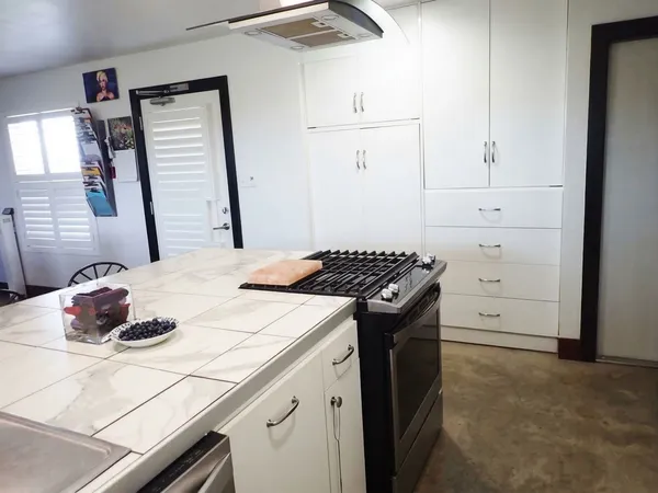 a kitchen with appliances and cabinets