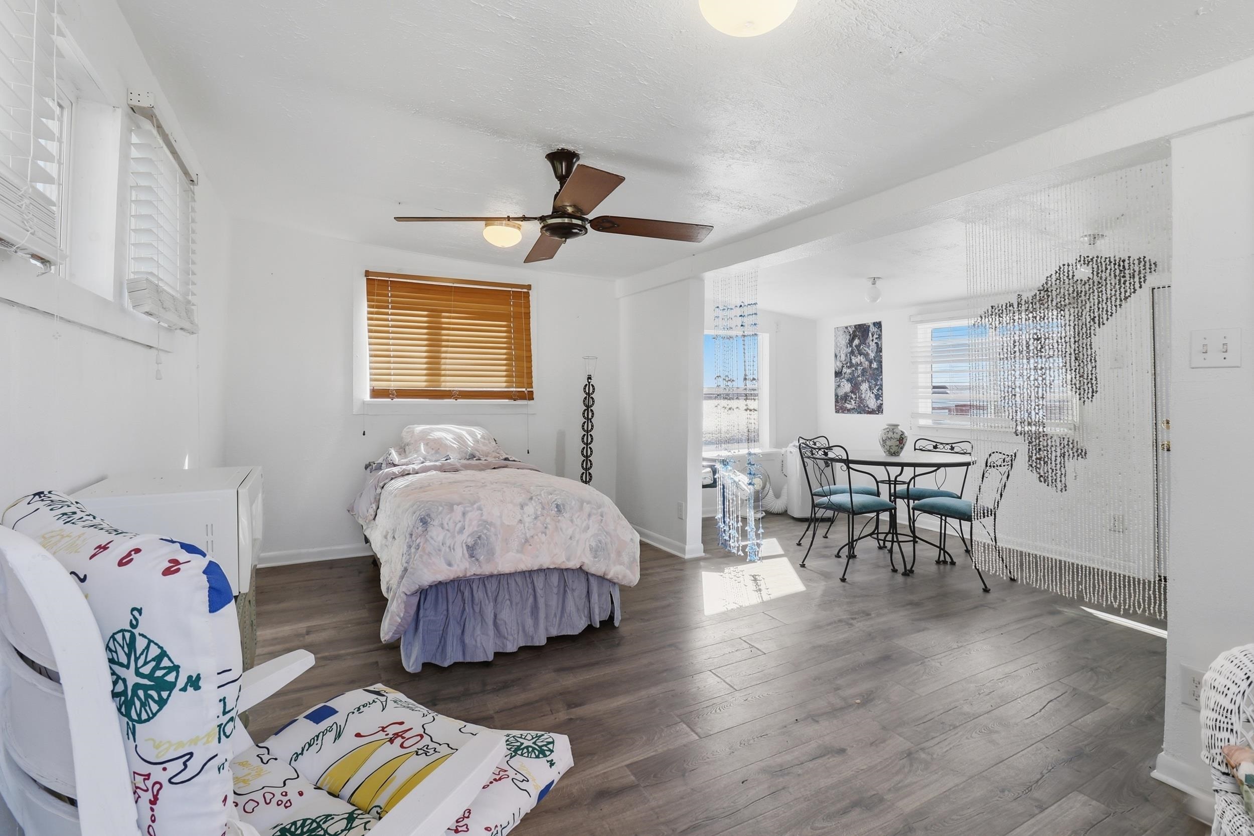 919 Lakeshore Loop Tow, TX 78672 - Photo 28 of 33 a spacious bedroom with a bed and a table in it