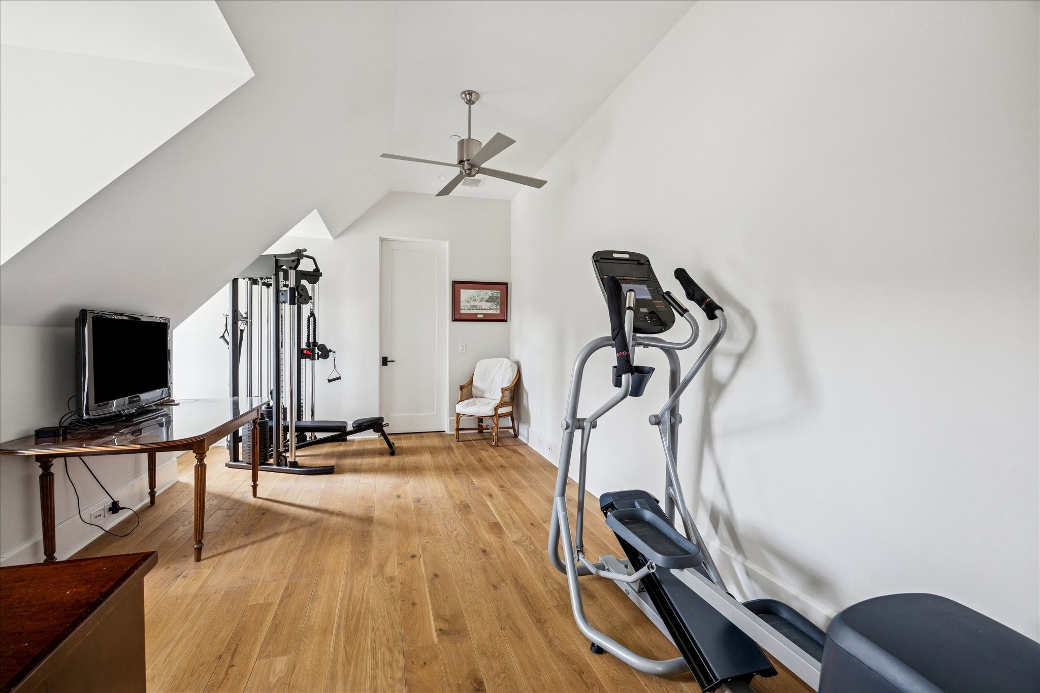 7 Hedwig Shadows Lane Houston, TX 77024 - Photo 37 of 46 A spacious and versatile upstairs flex room ideal for fitness or recreation. Crisp white walls and wide-plank oak floors keep the atmosphere fresh and motivating, with ample room for equipment or additional living uses.