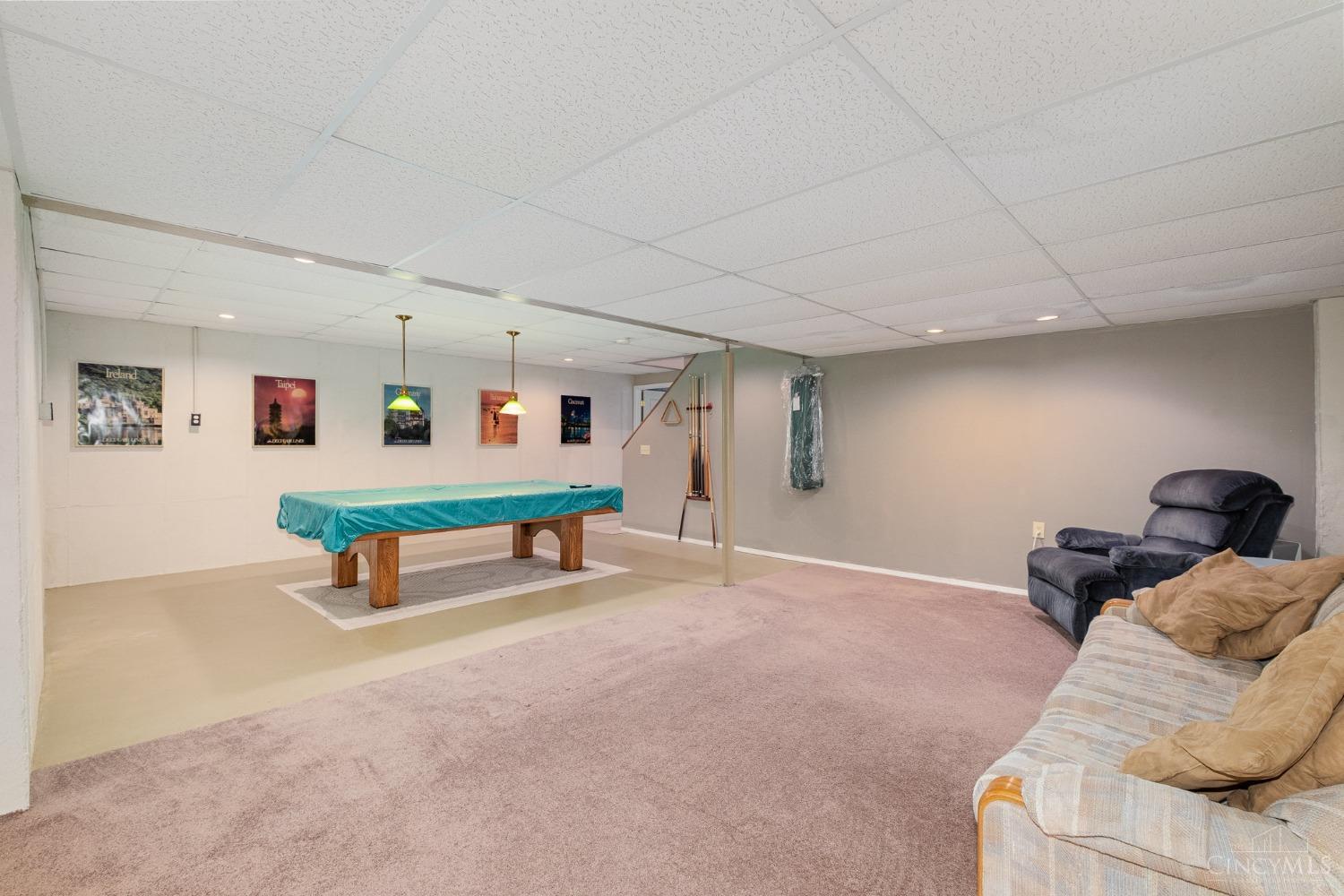 9728 Baughman Road Harrison, OH 45030 - Photo 31 of 56 Large carpeted rec room in lower level Pool table, recliner and sofa stay.