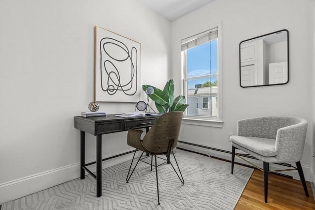 15 I Street, Unit 3 Boston, MA 02127 - Photo 11 of 17 a view of a livingroom with furniture and window