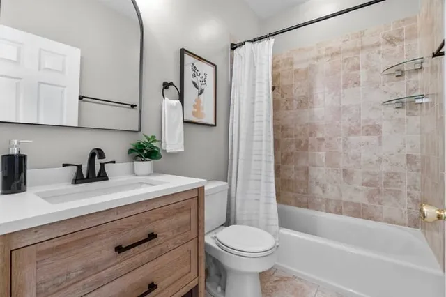 a bathroom with a sink a toilet and a bathtub