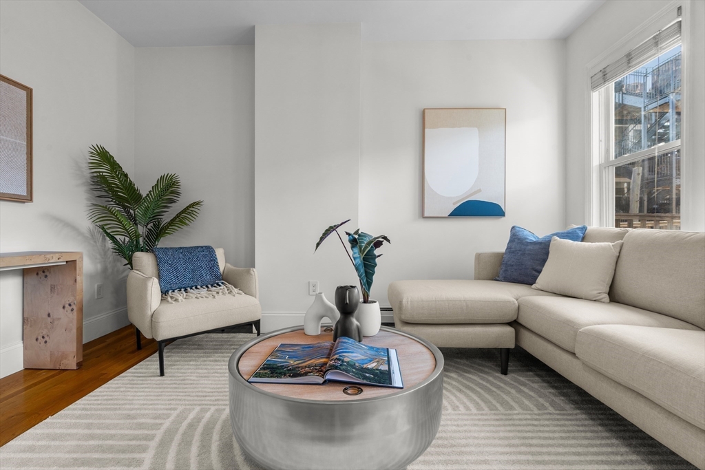 15 I Street, Unit 3 Boston, MA 02127 - Photo 8 of 17 a living room with furniture and a potted plant