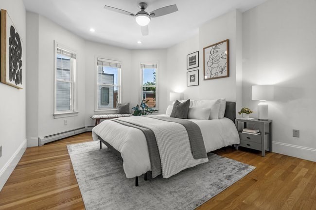 15 I Street, Unit 3 Boston, MA 02127 - Photo 9 of 17 a spacious bedroom with a bed and wooden floor