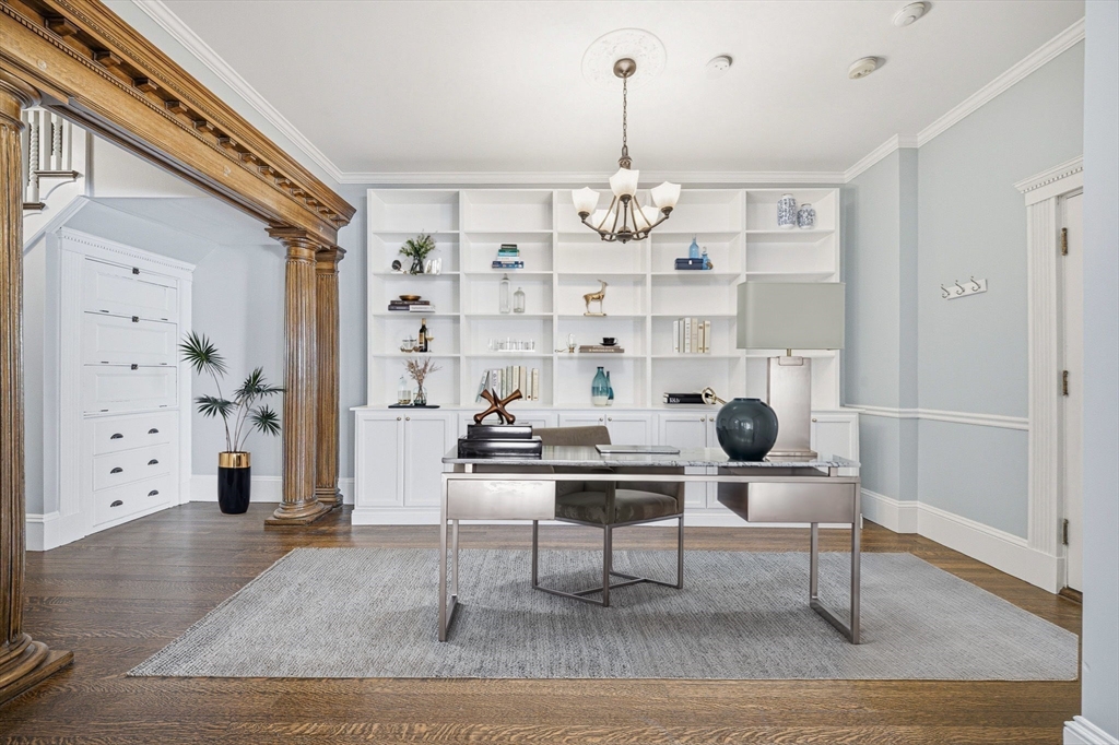 33 Adams Street, Unit 1 Boston, MA 02122 - Photo 14 of 36 a view of a livingroom with furniture wooden floor and chandelier