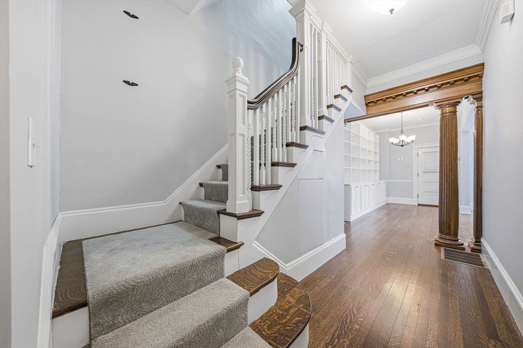 33 Adams Street, Unit 1 Boston, MA 02122 - Photo 21 of 36 a view of entryway and hall with wooden floor