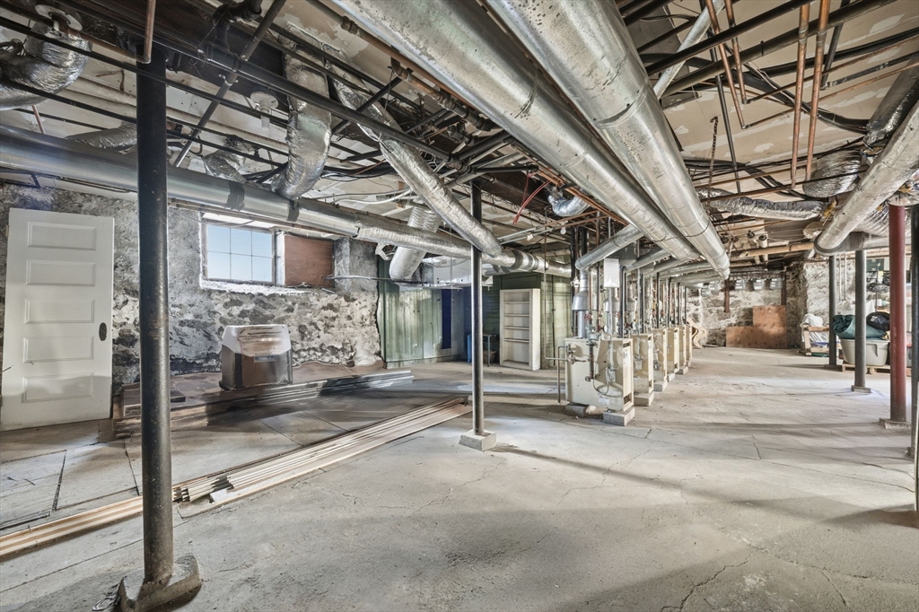 33 Adams Street, Unit 1 Boston, MA 02122 - Photo 31 of 36 a view of a hall with wooden floor