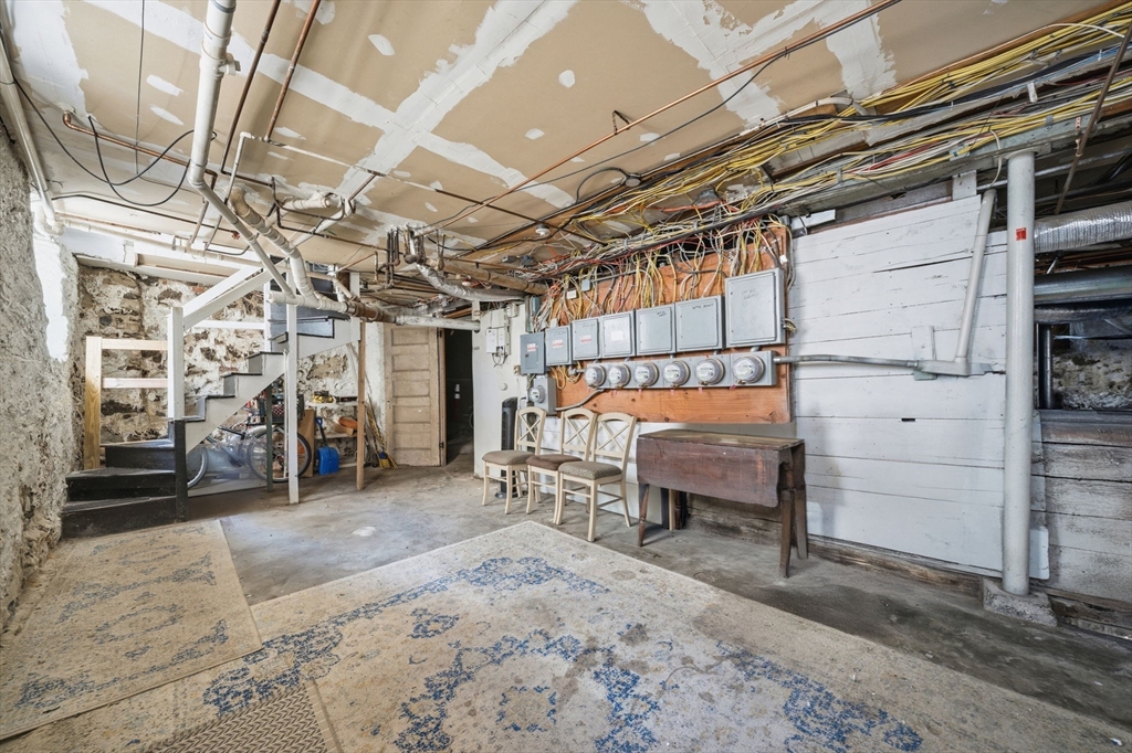 33 Adams Street, Unit 1 Boston, MA 02122 - Photo 32 of 36 a view of a room with racks on the wall