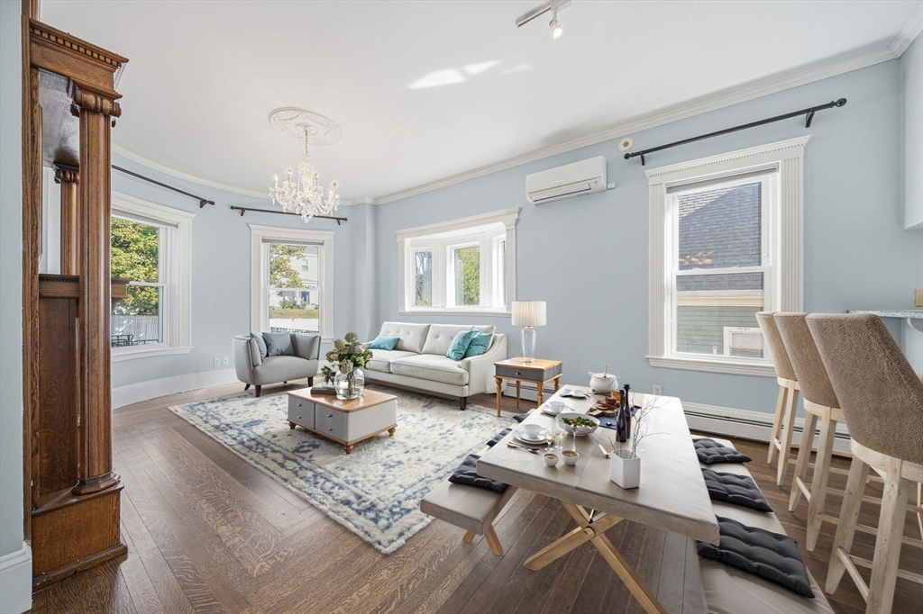 33 Adams Street, Unit 1 Boston, MA 02122 - Photo 5 of 36 a living room with furniture and a window