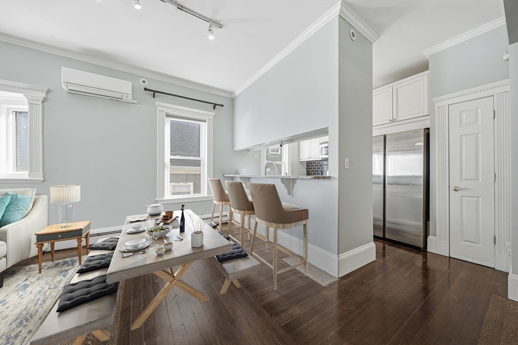 33 Adams Street, Unit 1 Boston, MA 02122 - Photo 8 of 36 a view of a livingroom with furniture window and wooden floor