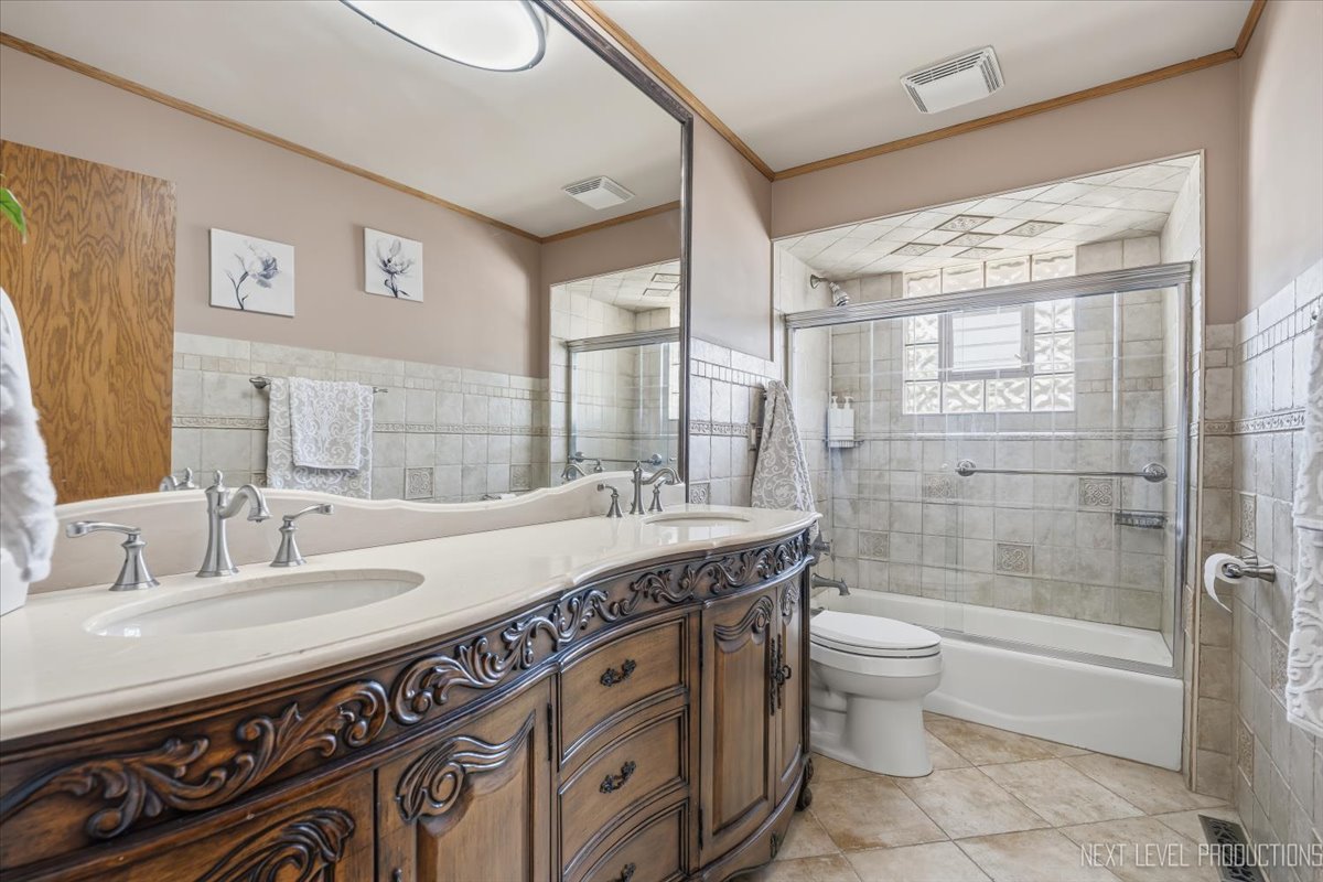 754 North Michigan Street Elmhurst, IL 60126 - Photo 16 of 32 a spacious bathroom with a granite countertop sink a toilet and shower