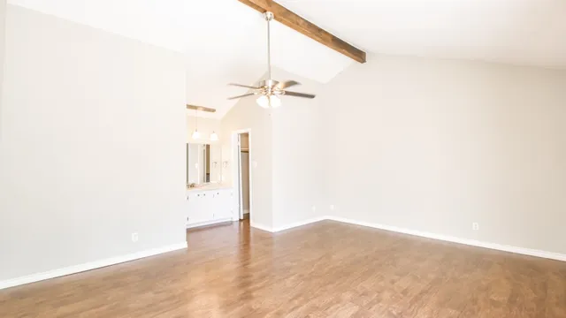 a view of a small space with wooden floor