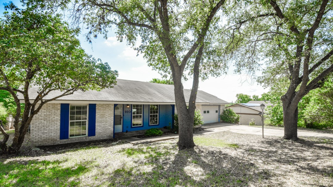 910 Rocky Spring Road Austin, TX 78753 - Photo 2 of 26 a view of a house with a yard and tree s