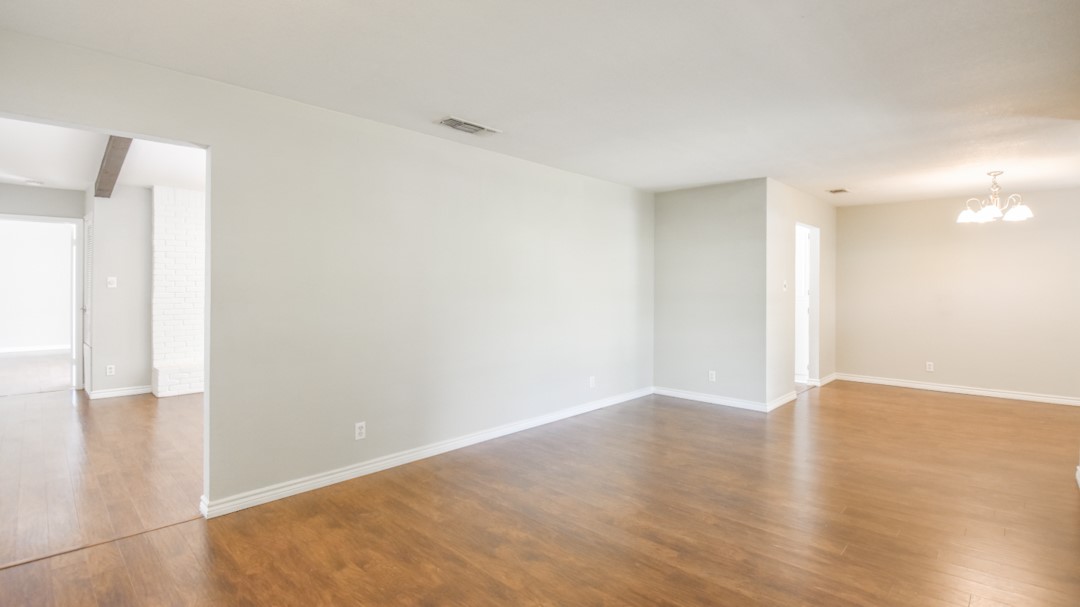 910 Rocky Spring Road Austin, TX 78753 - Photo 5 of 26 a view of an empty room with wooden floor
