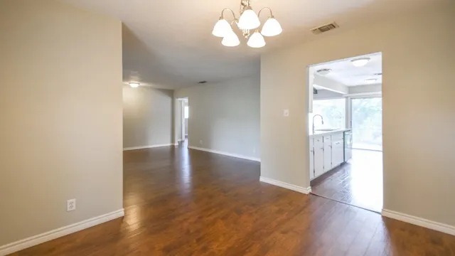 a view of a livingroom with wooden floor