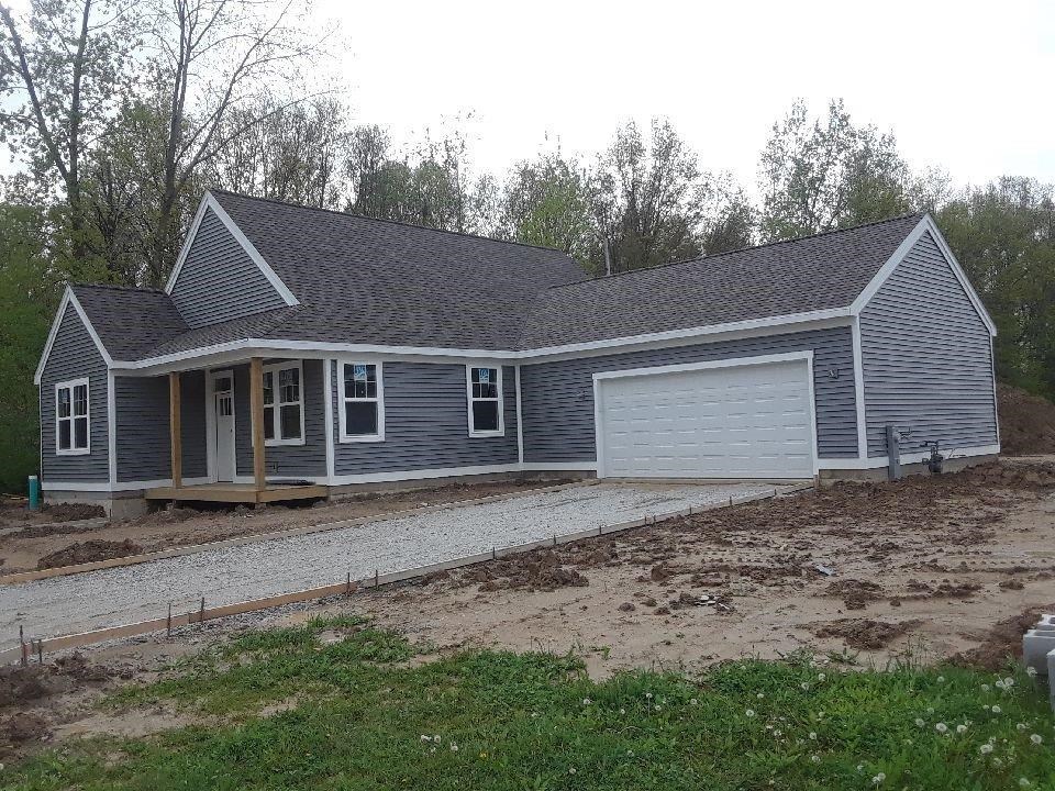 341 Bolinger Lane Chesterton, IN 46304 - Photo 1 of 1 a front view of a house with a yard and garage