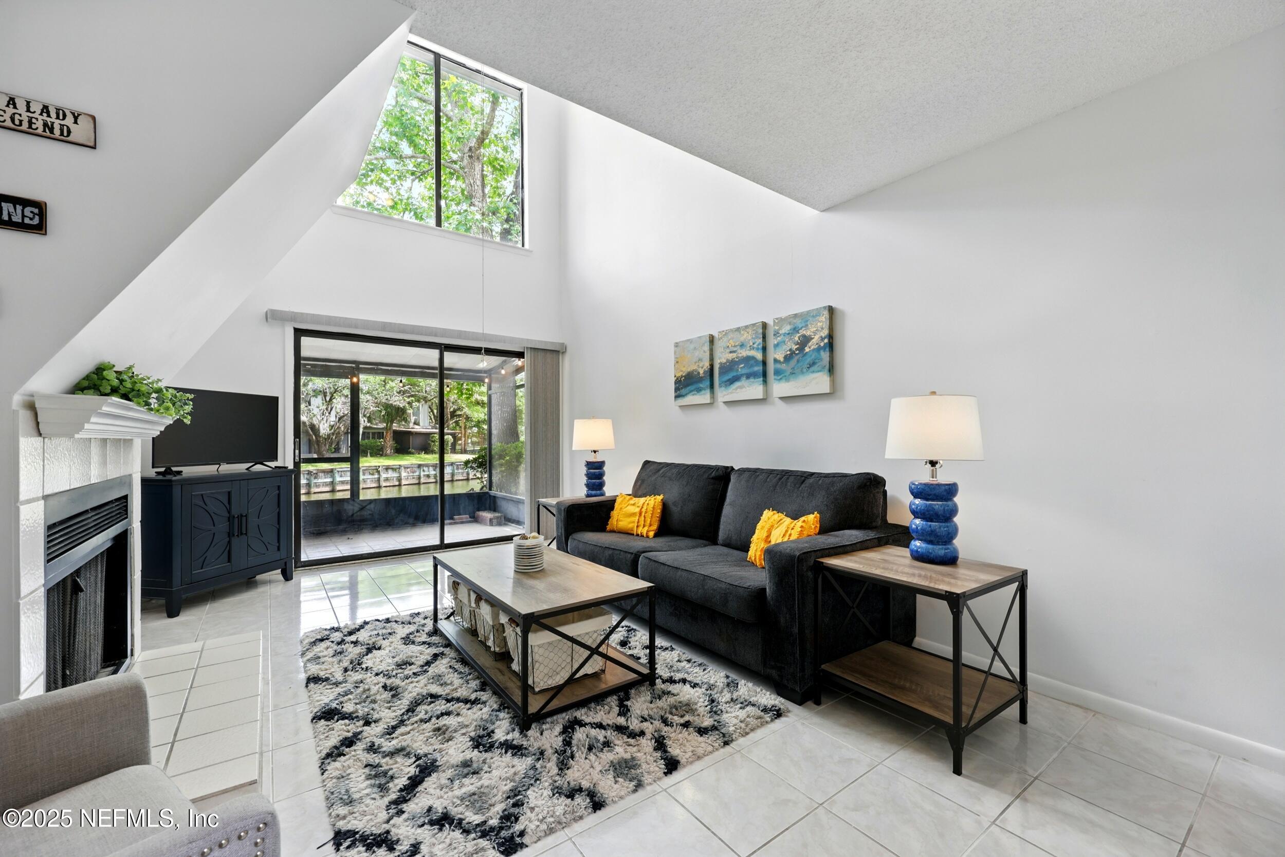 9360 Craven Road, Unit 1406 Jacksonville, FL 32257 - Photo 1 of 30 a living room with furniture and a window