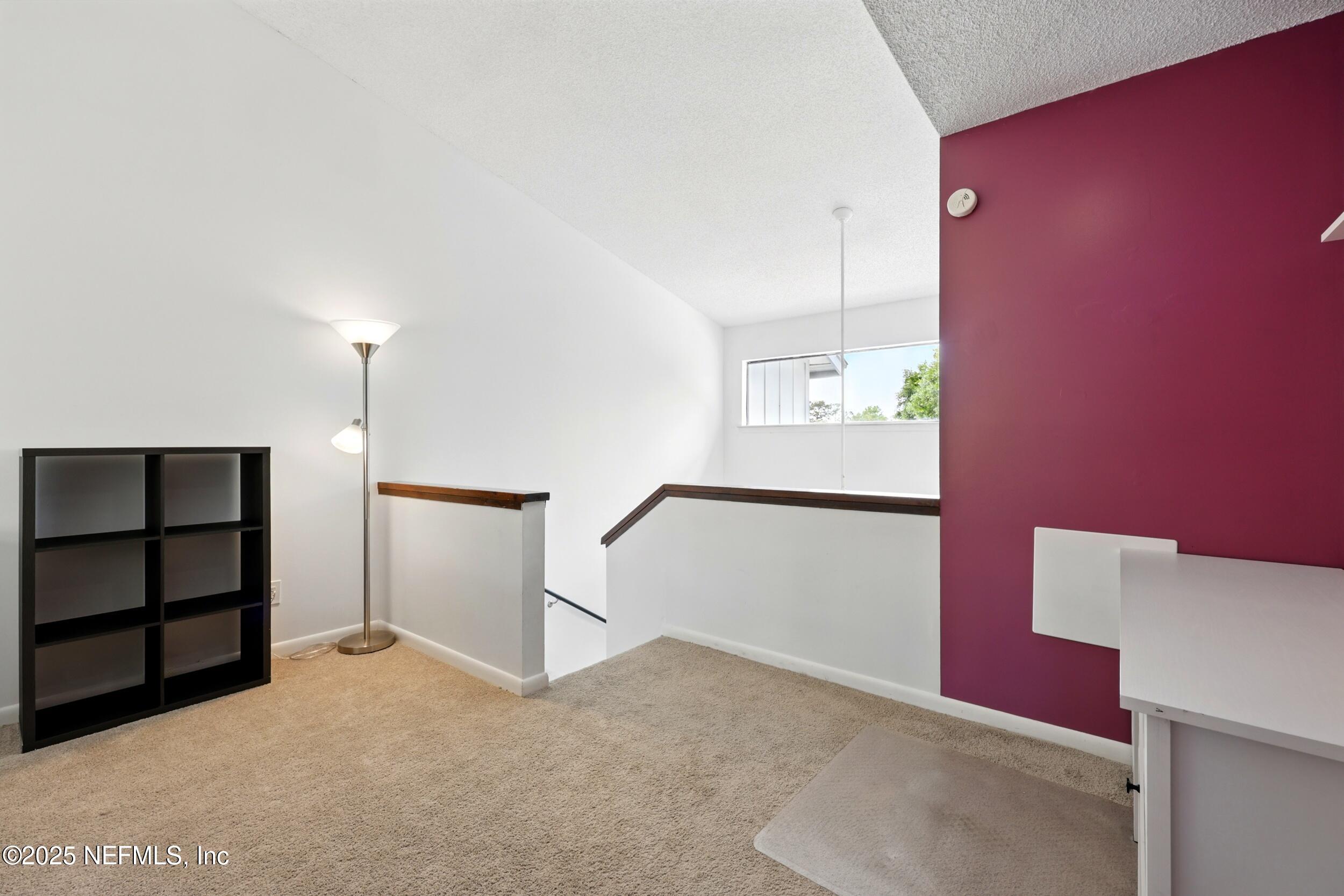 9360 Craven Road, Unit 1406 Jacksonville, FL 32257 - Photo 20 of 30 a view of a livingroom with a staircase