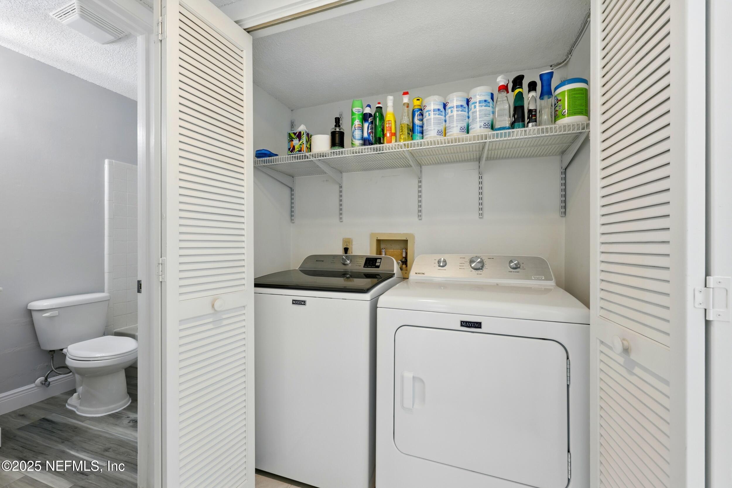 9360 Craven Road, Unit 1406 Jacksonville, FL 32257 - Photo 25 of 30 a utility room with dryer and washer