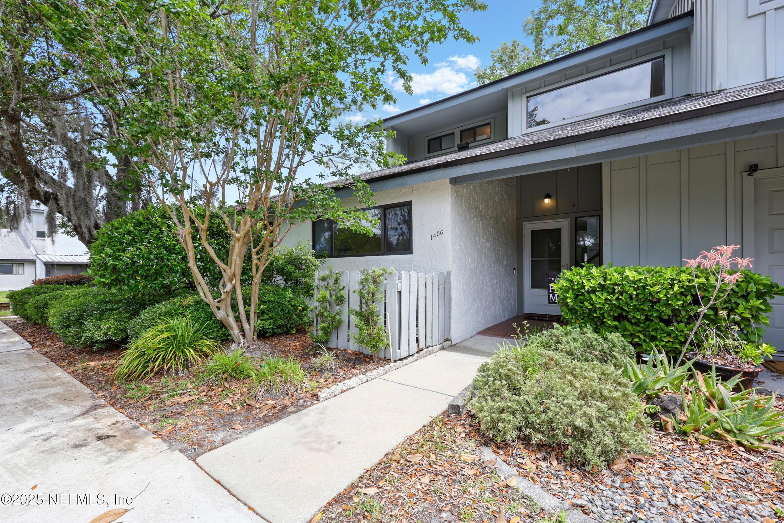 9360 Craven Road, Unit 1406 Jacksonville, FL 32257 - Photo 27 of 30 front view of a house with a yard