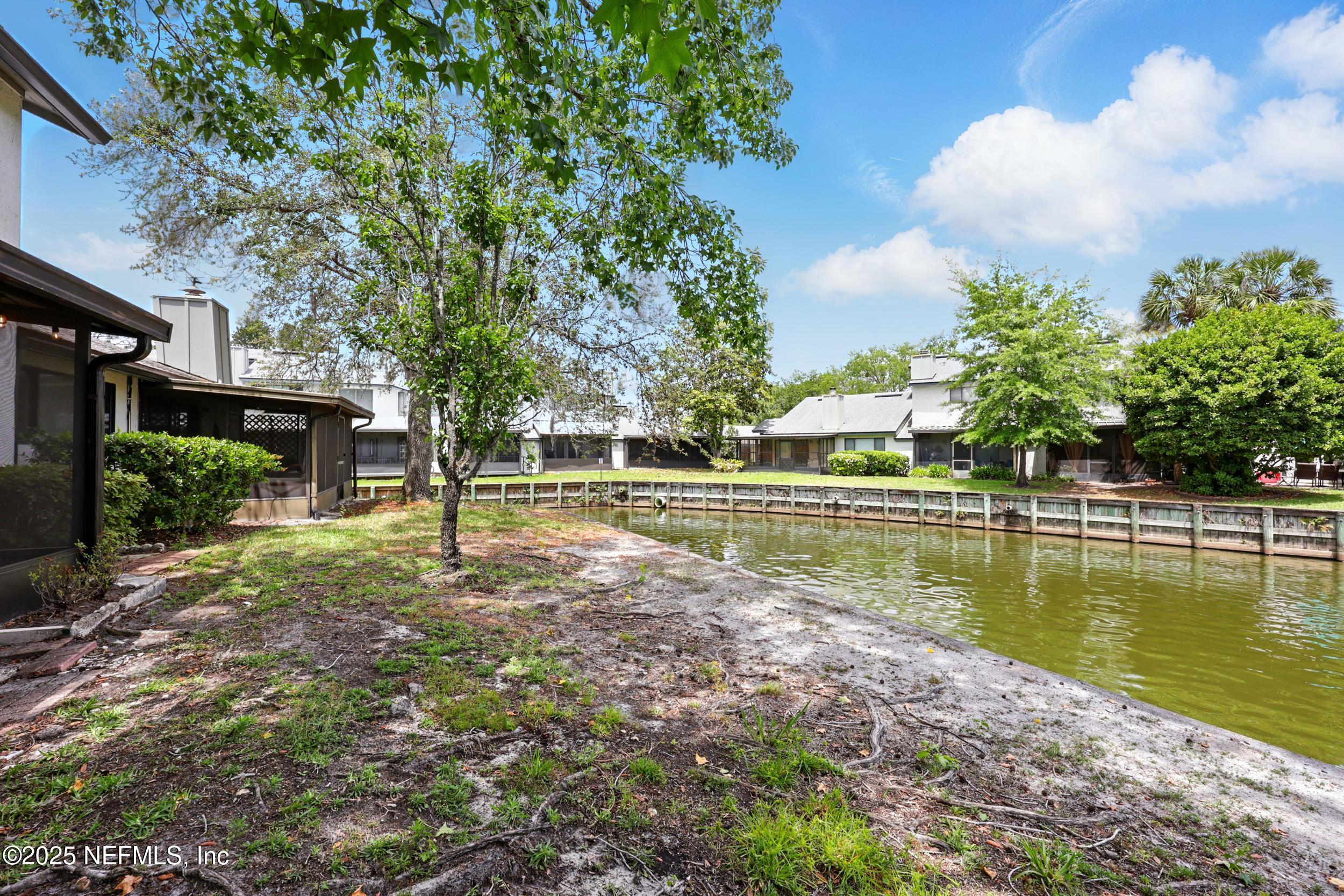 9360 Craven Road, Unit 1406 Jacksonville, FL 32257 - Photo 29 of 30 a view of a house with a yard