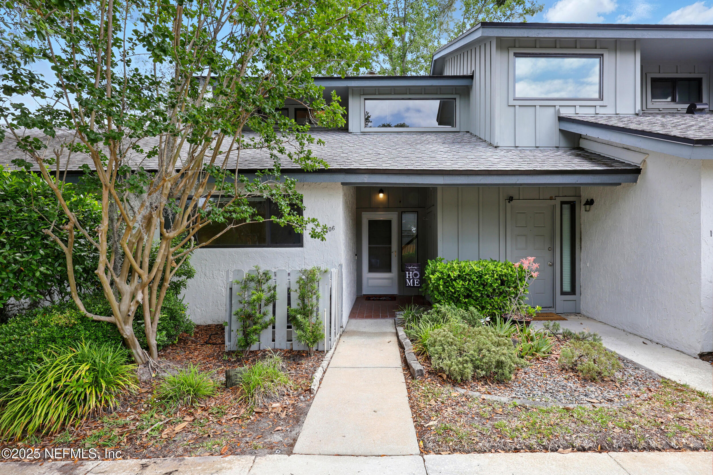 9360 Craven Road, Unit 1406 Jacksonville, FL 32257 - Photo 4 of 30 a front view of a house with garden