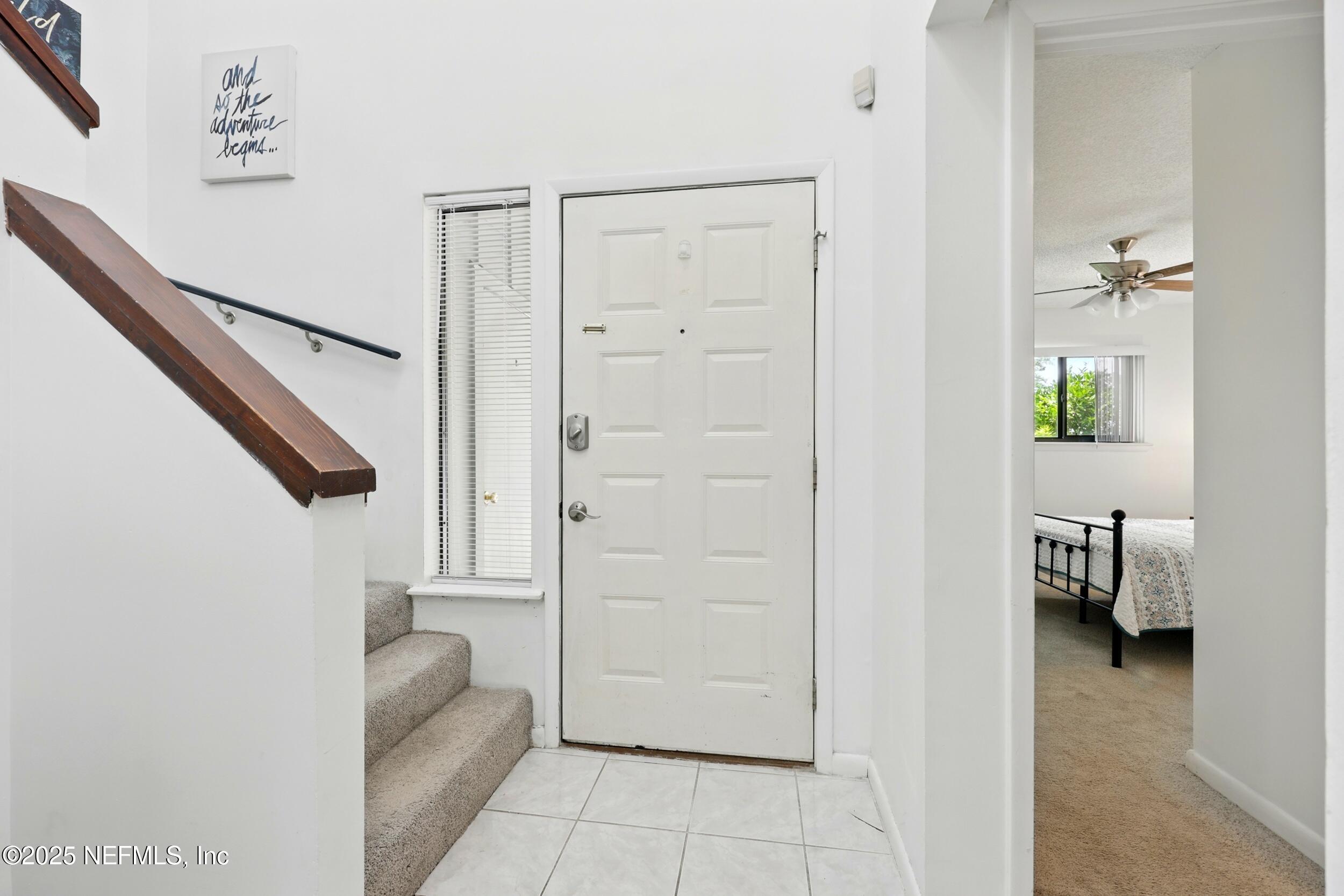 9360 Craven Road, Unit 1406 Jacksonville, FL 32257 - Photo 9 of 30 a view of hallway with livingroom and furniture