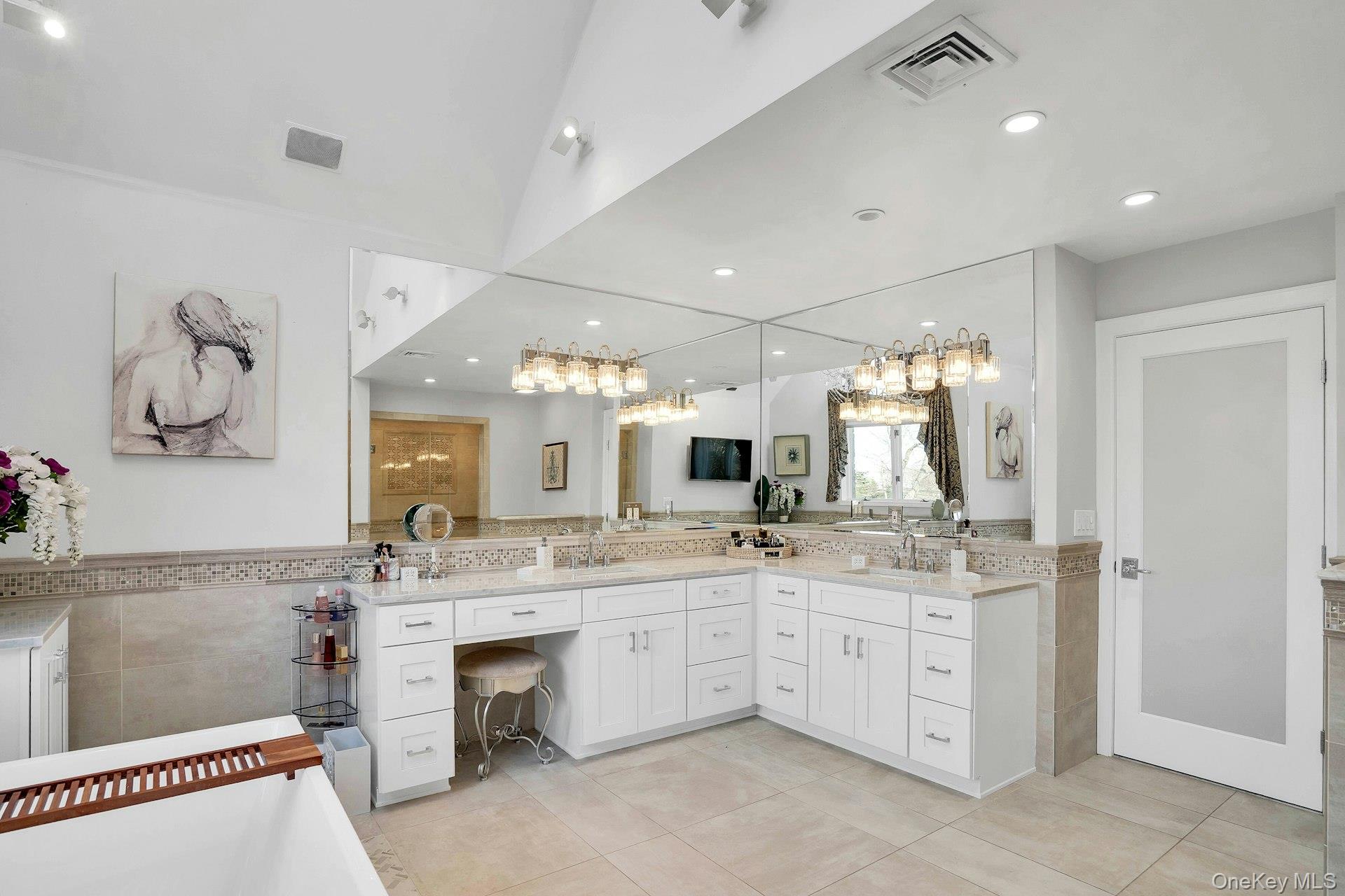 10 Beech Road Islip, NY 11751 - Photo 31 of 49 a bathroom with a sink double vanity and a mirror