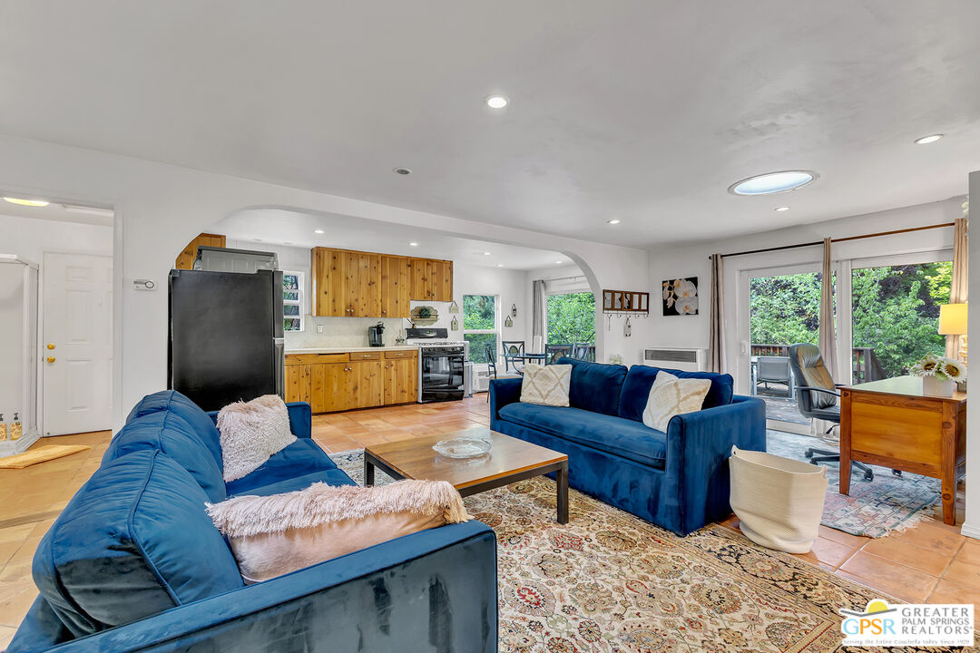 25300 Tahquitz Road Idyllwild, CA 92549 - Photo 21 of 75 a living room with furniture and a large window