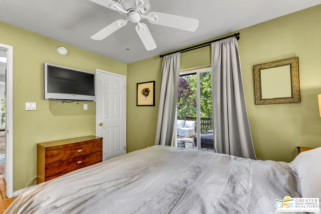 25300 Tahquitz Road Idyllwild, CA 92549 - Photo 31 of 75 a bedroom with a bed and a flat screen tv