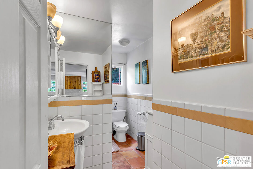 25300 Tahquitz Road Idyllwild, CA 92549 - Photo 32 of 75 a bathroom with a sink mirror toilet and bathtub