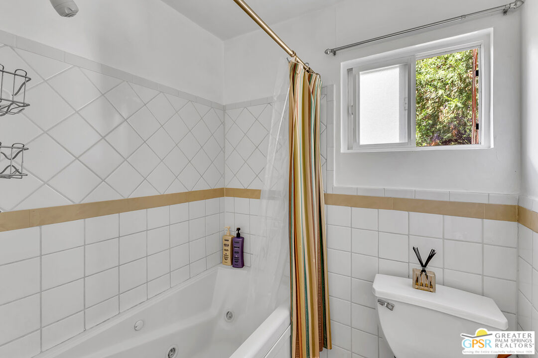 25300 Tahquitz Road Idyllwild, CA 92549 - Photo 34 of 75 a bathroom with a bathtub and a shower
