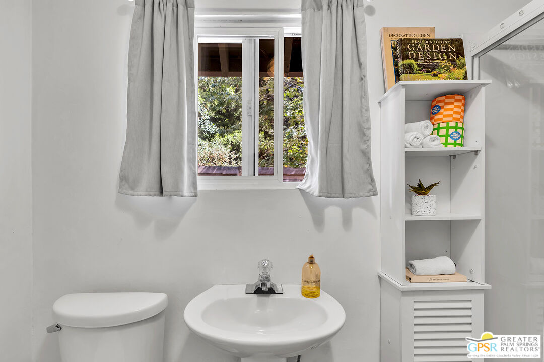 25300 Tahquitz Road Idyllwild, CA 92549 - Photo 37 of 75 a bathroom with a toilet sink and mirror