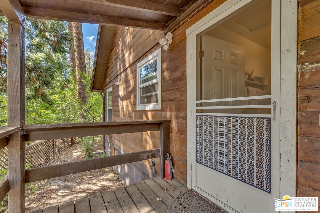 25300 Tahquitz Road Idyllwild, CA 92549 - Photo 39 of 75 a view of a balcony with wooden floor
