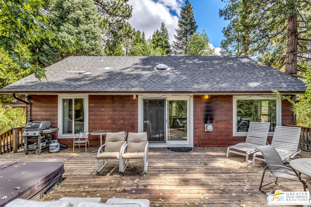 25300 Tahquitz Road Idyllwild, CA 92549 - Photo 4 of 75 a backyard of a house with seating space