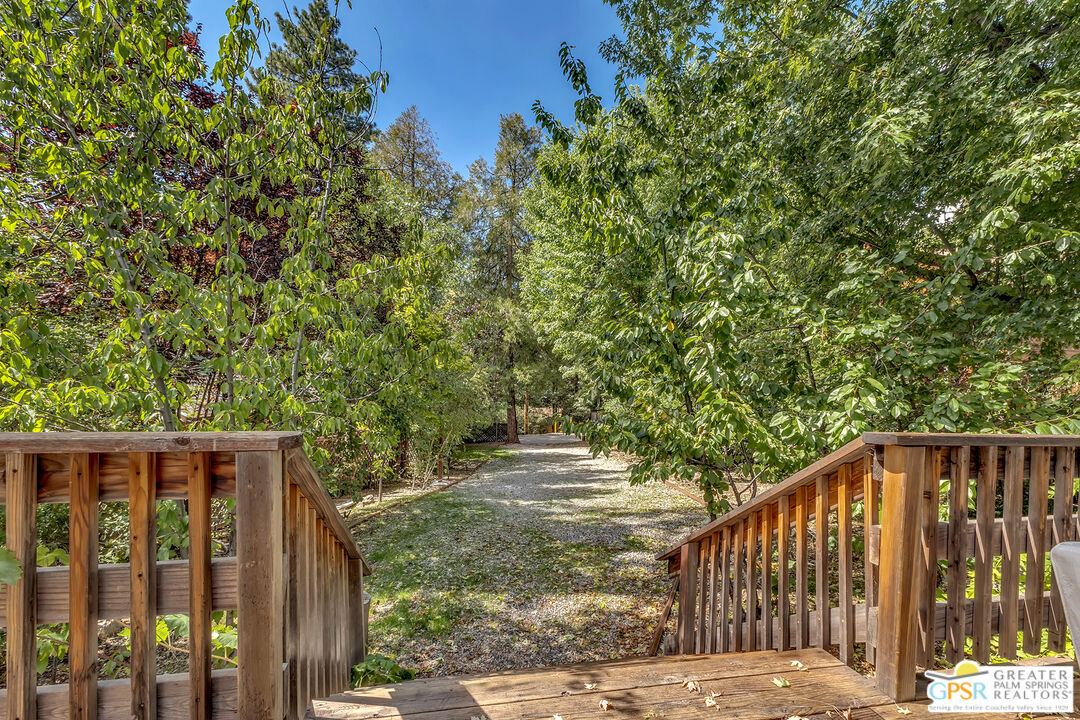25300 Tahquitz Road Idyllwild, CA 92549 - Photo 42 of 75 a wooden fence with trees in the background