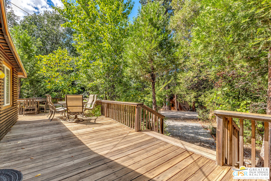 25300 Tahquitz Road Idyllwild, CA 92549 - Photo 49 of 75 a view of a wooden deck and chairs